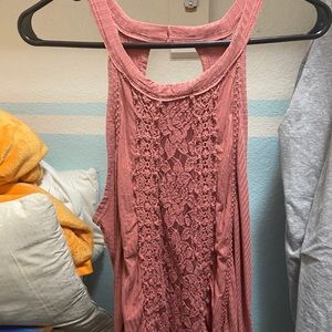 Cute tank top with a floral accent flow large